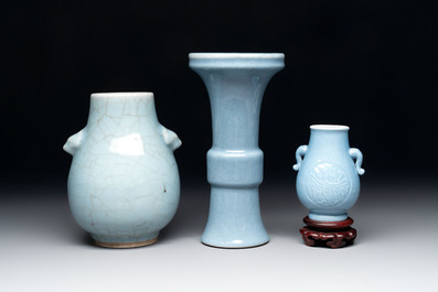 Three Chinese claire-de-lune vases, one with a wooden stand, Yongzheng mark, 19/20th C.