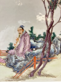 A Chinese famille rose plaque with a sage and a lady in a garden, signed Huang Can 黃燦, Republic