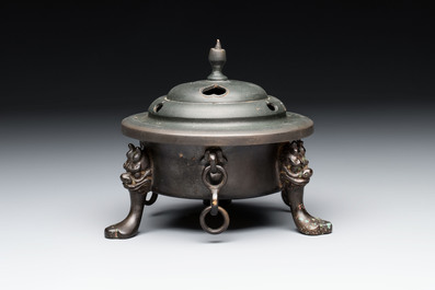 A Chinese bronze tripod censer and cover, Sui/Tang