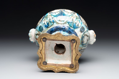 A polychrome Qajar ewer and a gilt bronze-mounted vessel, Iran, 19th C.
