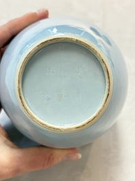 A pair of Chinese claire-de-lune jars and covers on wooden stands, Kangxi mark, 19th C.