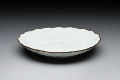 A Chinese moulded white-glazed plate with anhua floral design, Xuande mark, Ming