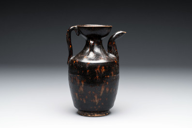 A Chinese Jizhou tortoiseshell-glazed tea bowl, a ewer and a black-glazed vase, Jin and later
