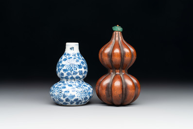 A Chinese blue and white double-gourd snuff bottle and a huali snuff bottle, Xuande and Qianlong mark, 18th C.