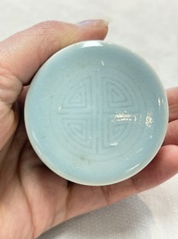 A pair of Chinese claire-de-lune jars and covers on wooden stands, Kangxi mark, 19th C.