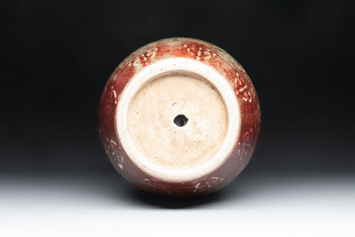 A Chinese peachbloom-glazed vase with dragon-form handles, 18th C.