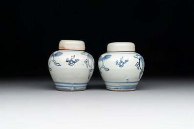 A pair of Chinese white-glazed vases and a pair of blue and white covered jars, Wanli mark and of the period