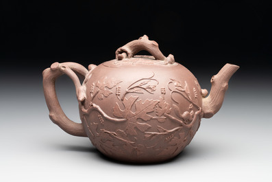 A Chinese Yixing stoneware 'squirrels among grapevines' teapot and cover, Kangxi