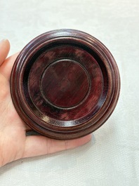 A pair of Chinese claire-de-lune jars and covers on wooden stands, Kangxi mark, 19th C.