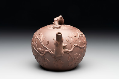 A Chinese Yixing stoneware 'squirrels among grapevines' teapot and cover, Kangxi