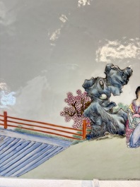 A Chinese famille rose plaque with a sage and a lady in a garden, signed Huang Can 黃燦, Republic