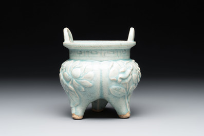 A Chinese qingbai tripod censer with floral relief design, Song/Yuan