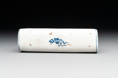 A Chinese blue and white wrist rest with figural design, 19th C.
