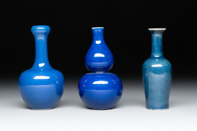 Three Chinese blue-glazed miniature vases on wooden stands and a claire-de-lune seal paste box and cover, 19th C.