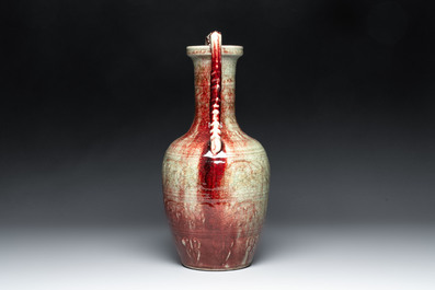 A Chinese peachbloom-glazed vase with dragon-form handles, 18th C.