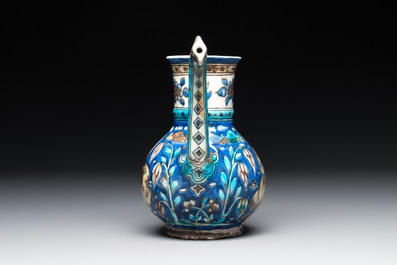 A polychrome Qajar ewer and a gilt bronze-mounted vessel, Iran, 19th C.