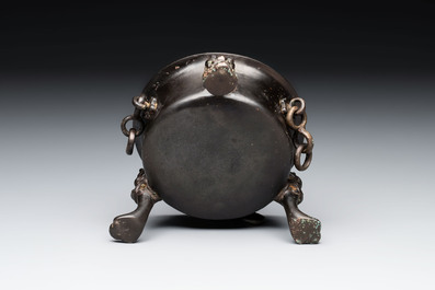 A Chinese bronze tripod censer and cover, Sui/Tang