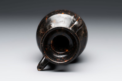 A Chinese Jizhou tortoiseshell-glazed tea bowl, a ewer and a black-glazed vase, Jin and later
