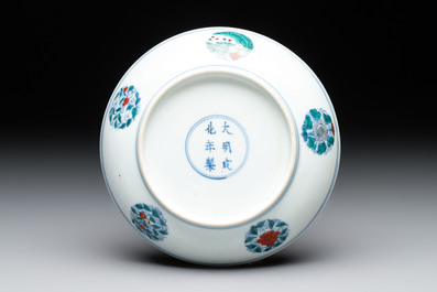 A Chinese doucai plate with stylized floral design, Chenghua mark, Kangxi/Yongzheng