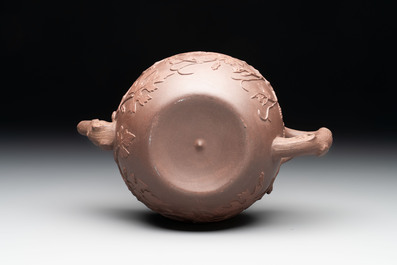 A Chinese Yixing stoneware 'squirrels among grapevines' teapot and cover, Kangxi