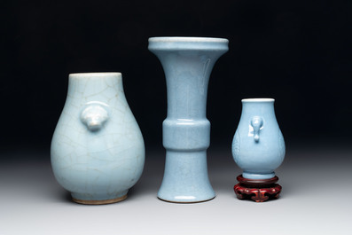 Three Chinese claire-de-lune vases, one with a wooden stand, Yongzheng mark, 19/20th C.