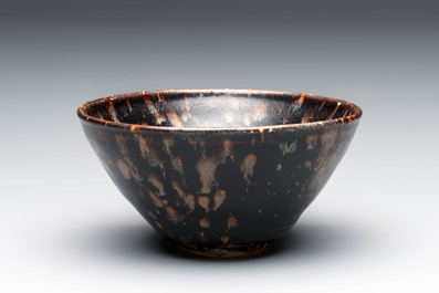 A Chinese Jizhou tortoiseshell-glazed tea bowl, a ewer and a black-glazed vase, Jin and later