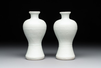 A pair of Chinese white-glazed vases and a pair of blue and white covered jars, Wanli mark and of the period