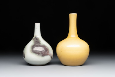 A Chinese copper-red 'mythical beasts' vase and a yellow-glazed bottle vase, with two wooden stands, Kangxi and later