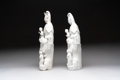 A pair of Chinese Dehua blanc de Chine groups of Guanyin with a child and servants, 18th C.