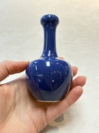 Three Chinese blue-glazed miniature vases on wooden stands and a claire-de-lune seal paste box and cover, 19th C.