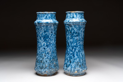 A pair of Spanish splashed blue pottery albarelli and an Italian blue, white and manganese albarello, Savona, 17/18th C.
