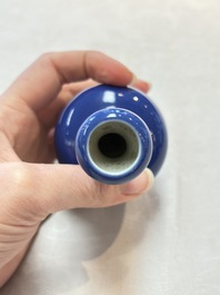 Three Chinese blue-glazed miniature vases on wooden stands and a claire-de-lune seal paste box and cover, 19th C.