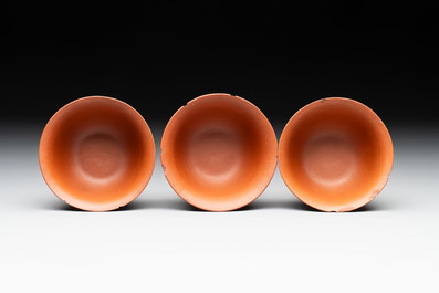 A set of five Chinese Yixing stoneware cups with floral design, Kangxi