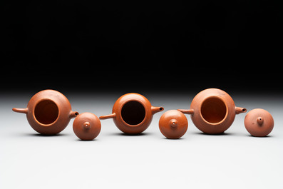 A small Chinese Yixing stoneware covered teapot and two Swatow Yixing-style covered teapots, Yixing Hui Mengchen 宜興惠孟臣製 and Shunji 順記 marks, 19/20th C