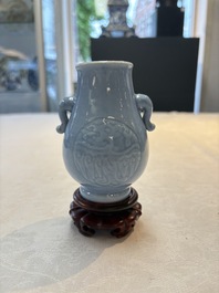 Three Chinese claire-de-lune vases, one with a wooden stand, Yongzheng mark, 19/20th C.