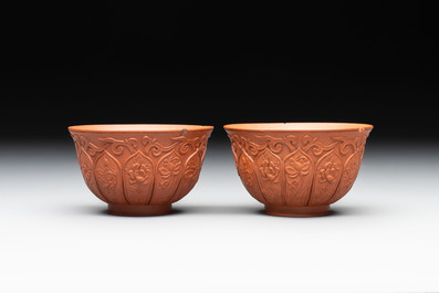 A set of five Chinese Yixing stoneware cups with floral design, Kangxi