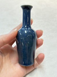 Three Chinese blue-glazed miniature vases on wooden stands and a claire-de-lune seal paste box and cover, 19th C.