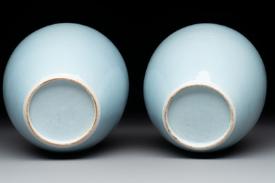 A pair of Chinese claire-de-lune jars and covers on wooden stands, Kangxi mark, 19th C.