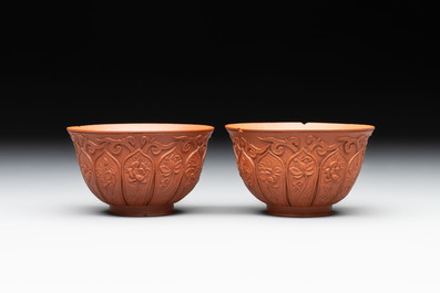 A set of five Chinese Yixing stoneware cups with floral design, Kangxi