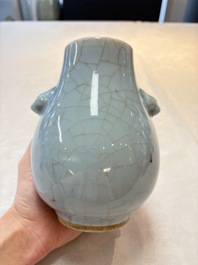 Three Chinese claire-de-lune vases, one with a wooden stand, Yongzheng mark, 19/20th C.
