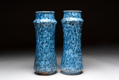 A pair of Spanish splashed blue pottery albarelli and an Italian blue, white and manganese albarello, Savona, 17/18th C.