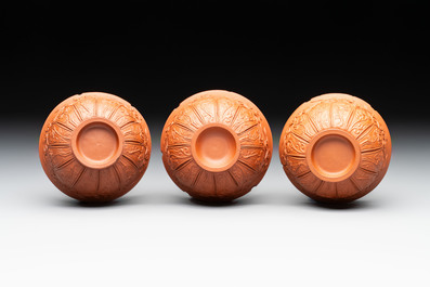 A set of five Chinese Yixing stoneware cups with floral design, Kangxi