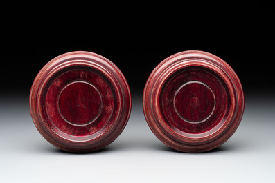 A pair of Chinese claire-de-lune jars and covers on wooden stands, Kangxi mark, 19th C.