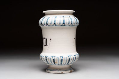 A pair of Spanish splashed blue pottery albarelli and an Italian blue, white and manganese albarello, Savona, 17/18th C.
