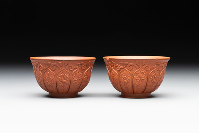 A set of five Chinese Yixing stoneware cups with floral design, Kangxi