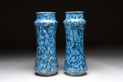 A pair of Spanish splashed blue pottery albarelli and an Italian blue, white and manganese albarello, Savona, 17/18th C.