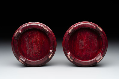 A pair of Chinese claire-de-lune jars and covers on wooden stands, Kangxi mark, 19th C.