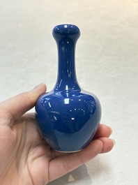 Three Chinese blue-glazed miniature vases on wooden stands and a claire-de-lune seal paste box and cover, 19th C.