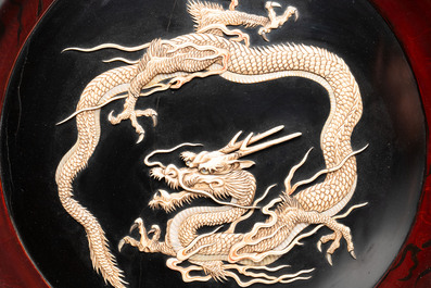 A large Japanese mother-of-pearl and bone-inlaid lacquer 'dragon' dish, Meiji, 19th C.