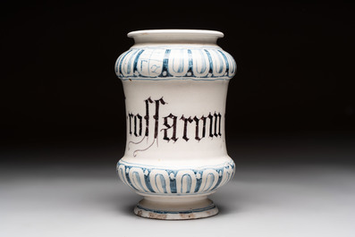 A pair of Spanish splashed blue pottery albarelli and an Italian blue, white and manganese albarello, Savona, 17/18th C.